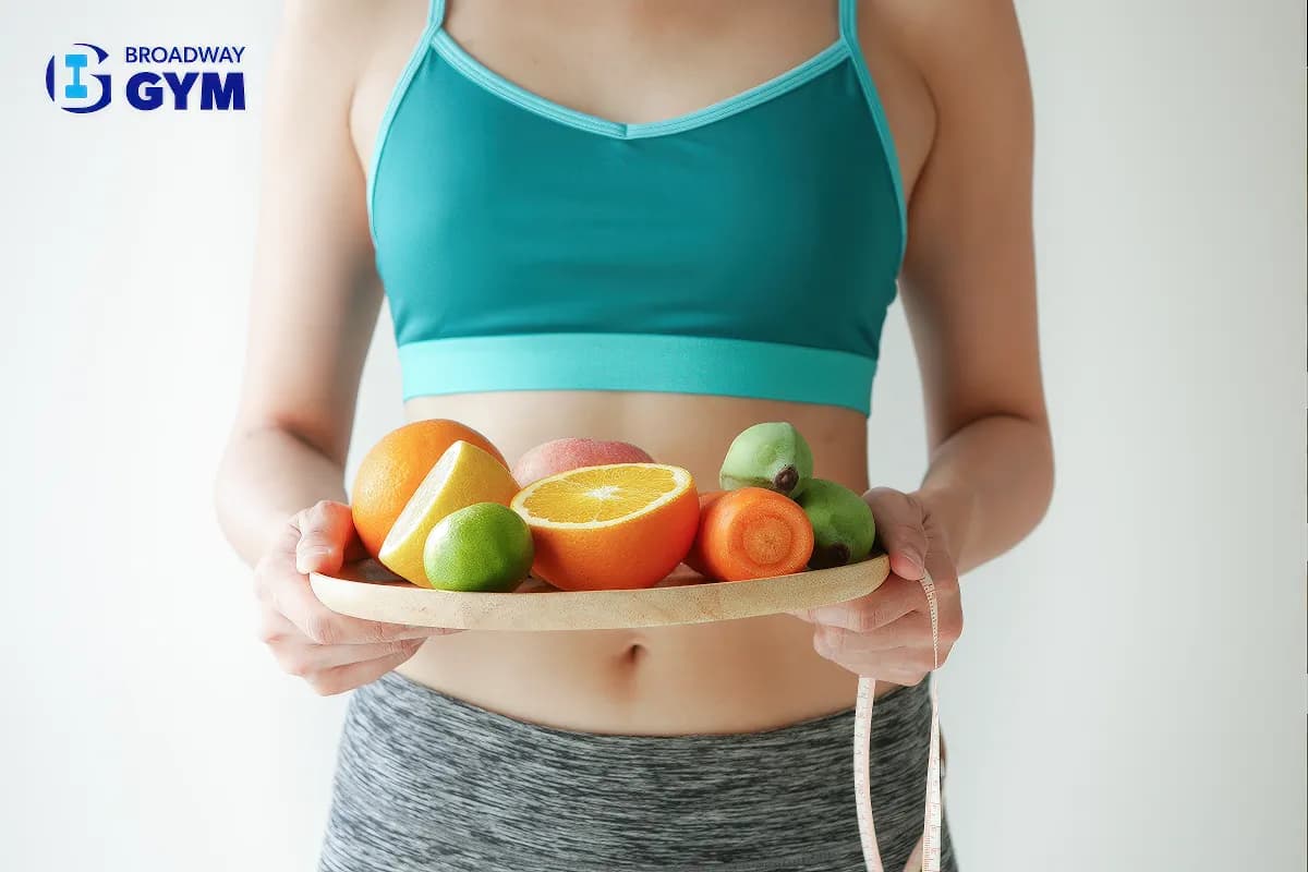 Woman holding a plate with fruits