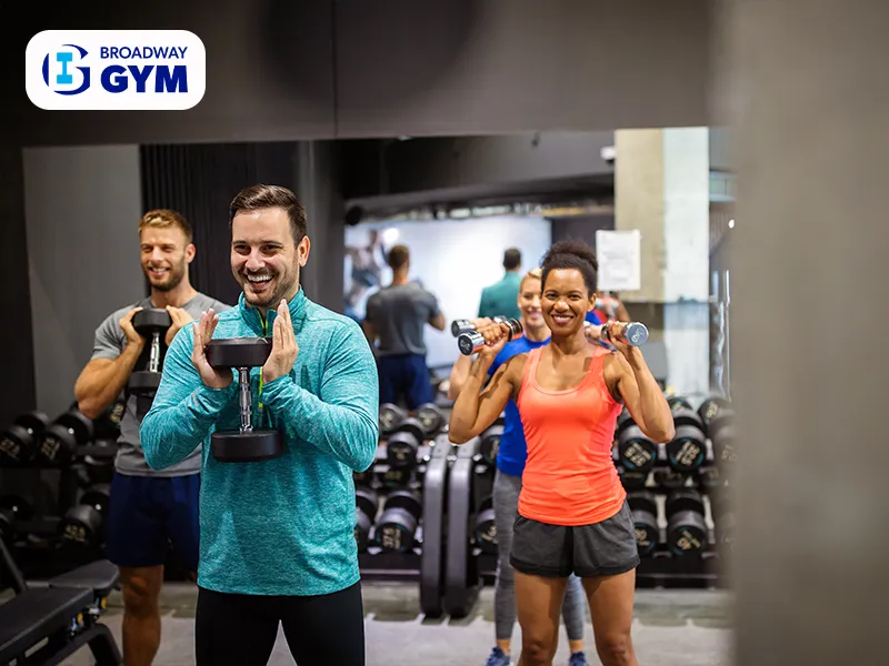 Group of happy friends in the gym